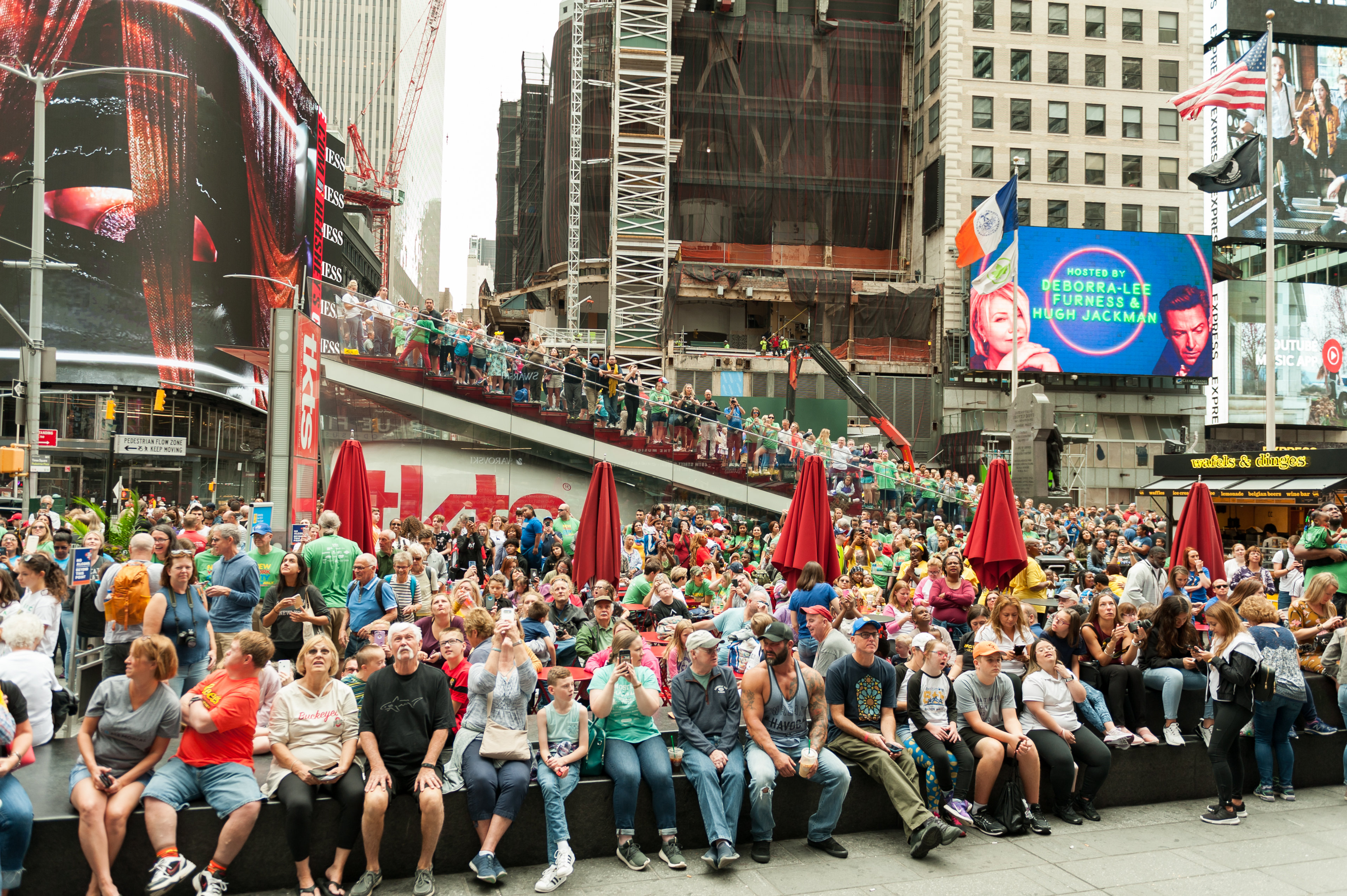 Group taking a photo in Times Square at NDSS Times Square Video Presentation