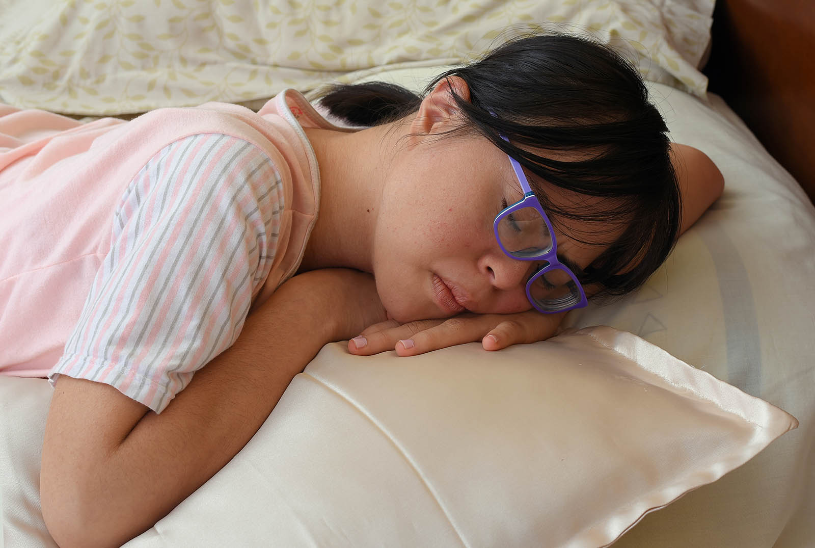 Adolescent with Down syndrome sleeping
