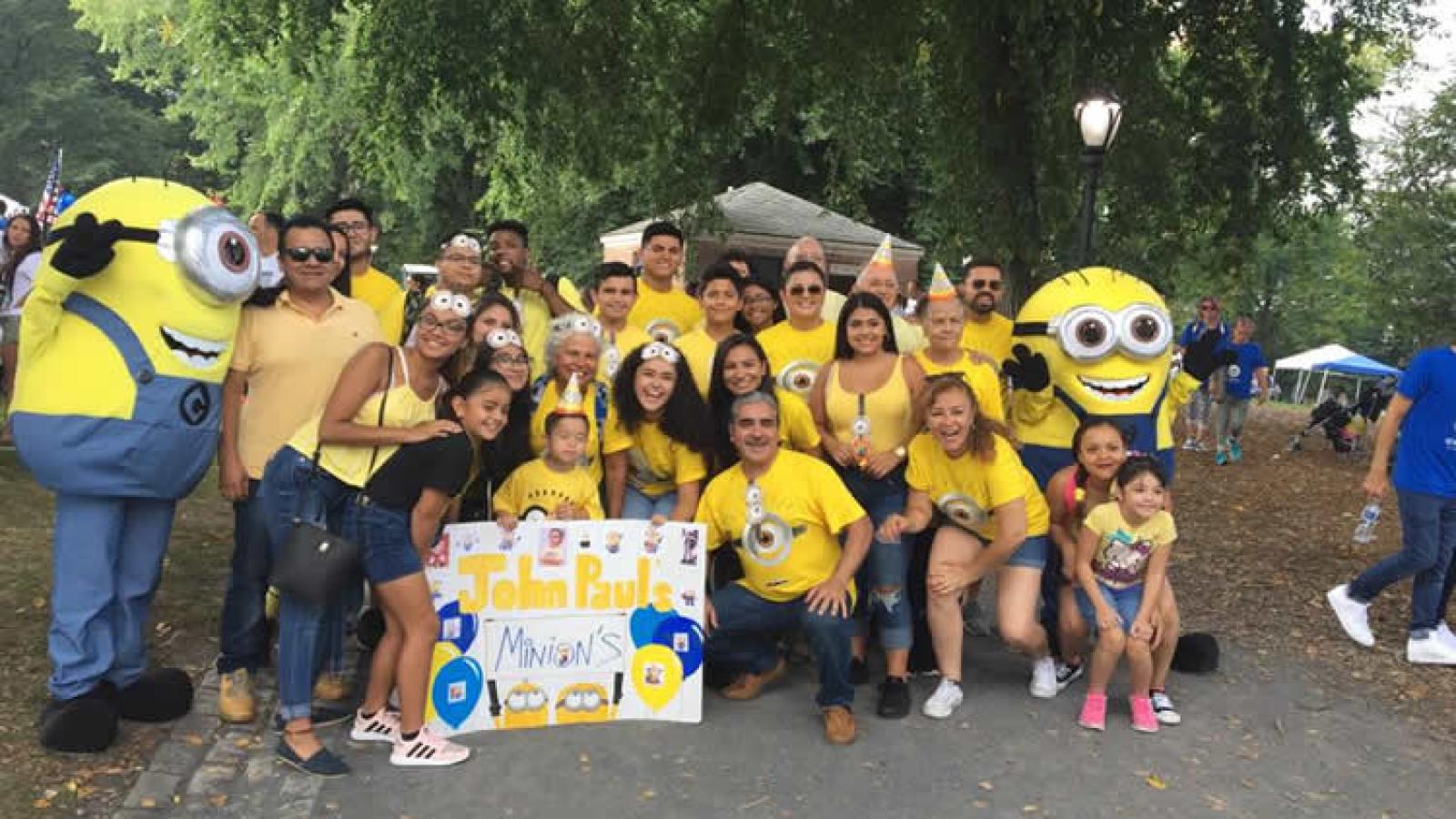 A group of people wearing Minion shirts.