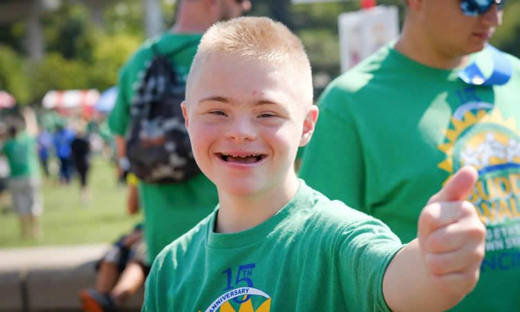Child gives a thumbs up.