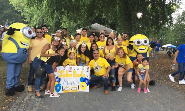 A group of people wearing Minion shirts.
