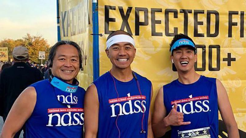 Three people in NDSS running gear