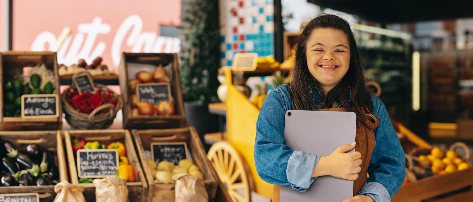 Young adult with Down syndrome working at a grocery store