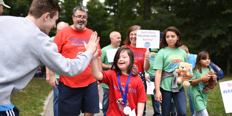 Young Buddy Walk participant gets a high five